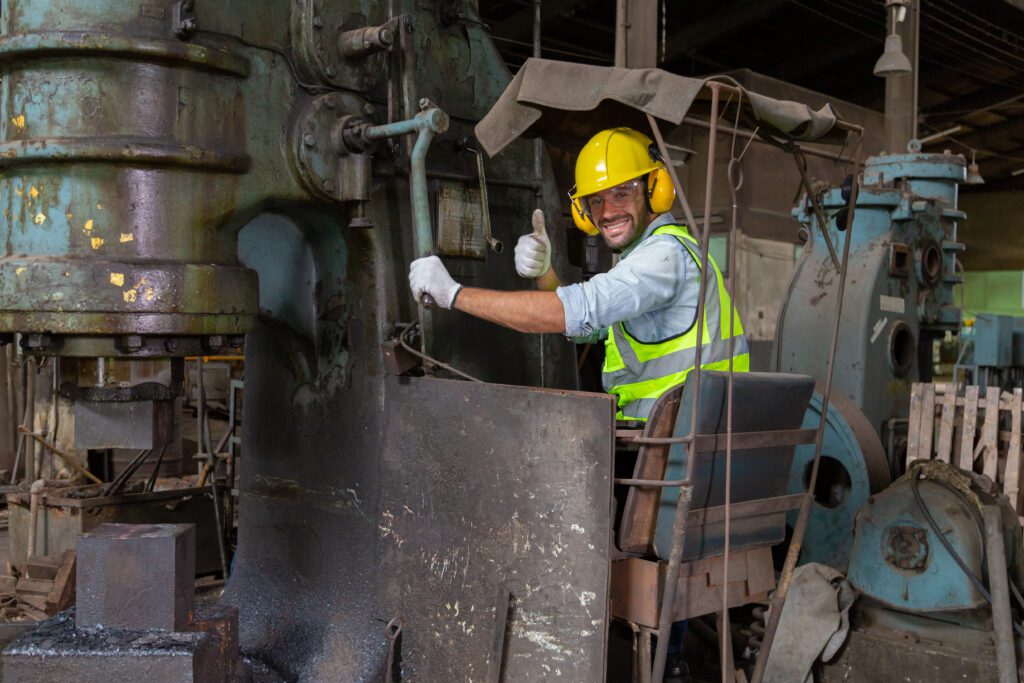 Two engineers in a steel mill Consult the size of the steel workpiece. Bring the workpiece to assemble the locomotive.