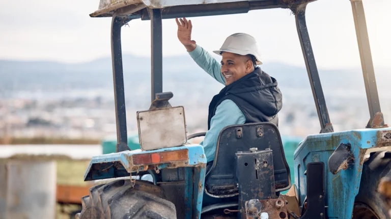 wave-greeting-and-man-on-a-tractor-for-farming-a-2023-11-27-05-11-32-utc