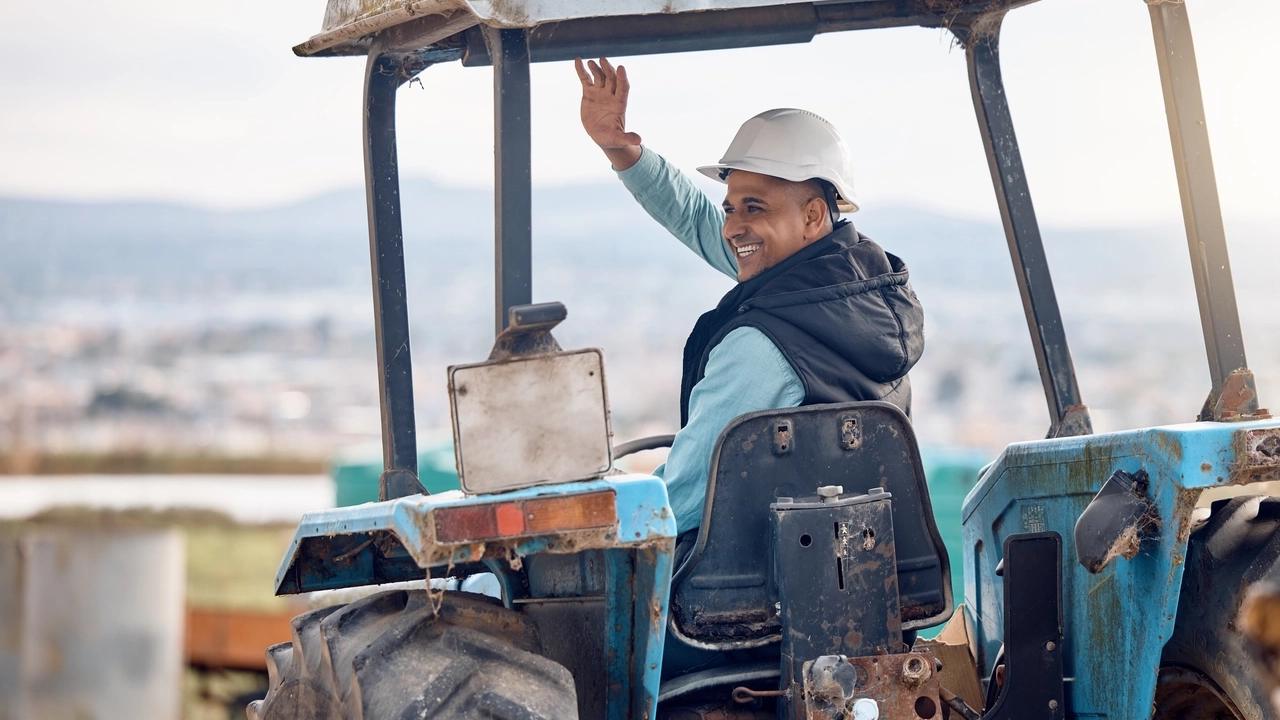 wave-greeting-and-man-on-a-tractor-for-farming-a-2023-11-27-05-11-32-utc